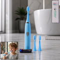 White battery operated electric toothbrush standing upright with brush head